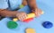 Child playing with modeling clay