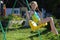 A child playing in an open area. Active child on a multi-colored swing