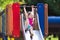 Child playing on outdoor playground in summer