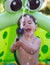 Child playing in plastic pool