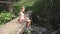 Child Playing by River Water, Kid at Camping in Mountains, Girl in Nature