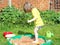 Child playing in a sandpit.