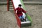 Child playing on slide