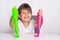 Child playing with slime. Kids squeeze and stretching slime.