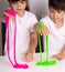 Child playing with slime. Kids squeeze and stretching slime.