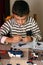 Child playing with a small lego bricks