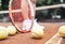 Child playing tennis on outdoor court. Cropped image of child legs on tennis court. Closeup of tennis ball, racket and shoes.