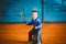 Child playing tennis on outdoor court. September 20, 2016. Ukraine, Kiev. Little tennis great player. Children sportswear adidas.