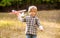 Child playing with toy airplane. Happy child playing. Happy child playing outdoors. Happy boy play airplane. Little boy