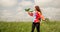 Child playing with toy plane