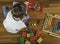 Child playing with toys tool kit while sitting on the floor in his room.Top view