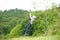 A child is playing with a Tyrolean traverse.