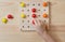 The child is playing with wooden colorful balls. Game for children