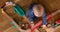 Child playing with wooden train top view