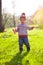 A child plays with a Frisbee outdoors.