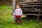 A child plays with a Frisbee outdoors.