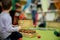 A child plays a musical instrument on Xylophone. Shallow depth of field