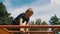 Child Plays in the Playground on the Uneven Bars against the Sky in Slow Motion