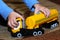 A child plays with a toy truck