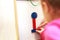 Child plays wooden magnetic educational game. girl plays with a toy on a white background