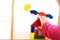 Child plays wooden magnetic educational game. girl plays with a toy on a white background