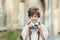 Child portrait: boy photographer  holding a instant camera