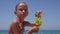 Child Portrait Eating Grapes on Beach, Girl Face Eats Fruits on Seashore 4K