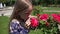 Child Portrait Smelling Roses Flowers Outdoor in Park, Girl Playing in Nature 4K