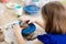 Child at pottery wheel. Kids arts and crafts class