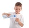 Child pouring water in a glass