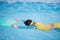 Child practice swimming by floating foam