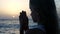 Child Praying on Beach at Sunset, Thoughtful Prayer Kid, Pensive Girl on Seaside