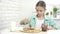 Child Preparing Pancakes at Breakfast, Kid Eating Chocolate in Kitchen, Girl Prepares Griddle-Cake at Home