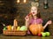 Child presenting harvest vegetable garden wooden background. Elementary school fall festival idea. Celebrate harvest