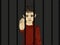 The child in prison. Children of criminals. Behind bars. Juvenile criminals. Angry and unhappy boy showing hand sign enough.