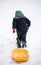 Child Pulling Sled in the Snow