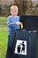 Child putting waste in bin