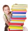 Child reading stack of books.