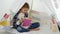 Child reading, studying in playroom, kid playing at playground, learning girl