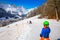 Child ready for skiing famous Ski resort in Swiss Alps.