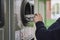 Child recycling plastic bottles in a machine