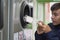 Child recycling plastic bottles in a machine