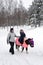 Child ride a pony in winter park