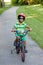 Child Riding His Bike on a Biking Trail