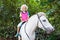 Child riding horse. Kids ride pony