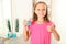 the child is rinsing the mouth with a mouthwash. Oral health in children