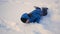 Child rolls head over heels with the hill in the snow