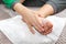 Child rubs the white powder into the foot. Foot skin hygiene.