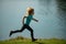 Child runners run in park. Boy running in the park in summer in nature. Outdoor sports and fitness, exercise and