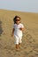 Child running in desert